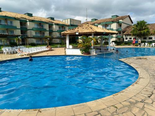 a large swimming pool in front of a hotel at Village das águas. in Barra do Piraí