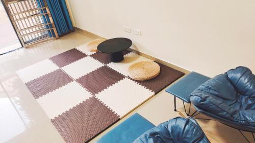 a table in a room with a table and chairs at 闲肆民宿 in Sanya