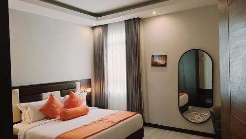 A bed or beds in a room at Lemaiyan Suites