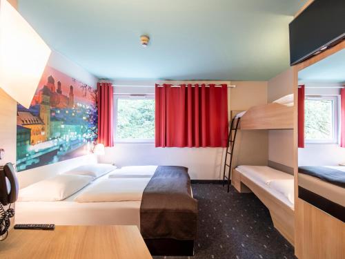 Postel nebo postele na pokoji v ubytování B&B Hotel Passau