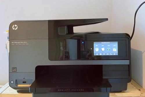 a computer printer with a monitor on top of it at nicole's home in Athens