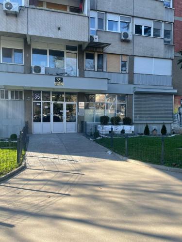 a building with a parking lot in front of it at Viewpoint in Belgrade