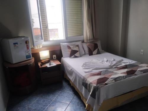 Postel nebo postele na pokoji v ubytování Hotel Ype de São Carlos