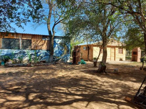 a building with a mural on the side of it at CABAÑA DOÑA ANGELA in Estancia Santa Clara
