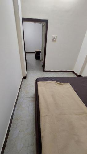 Katil atau katil-katil dalam bilik di HOTEL PRAKASH PALACE