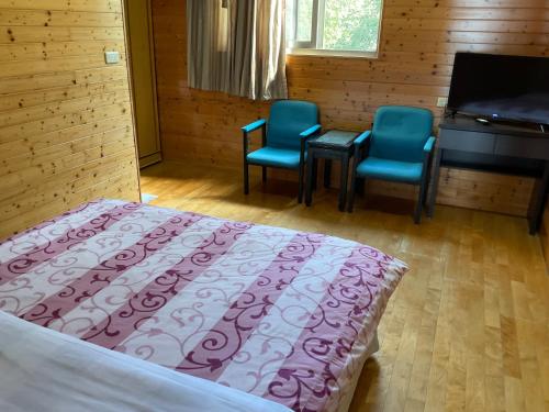 Postel nebo postele na pokoji v ubytování 星光山悦景觀民宿