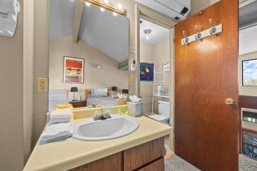 a bathroom with a sink and a bedroom at Powder Pointe A-205 in Park City