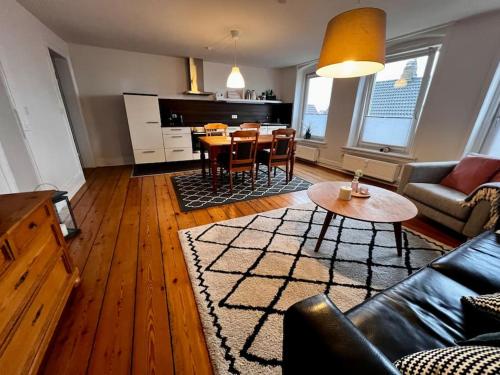 a living room with a couch and a table at Apartment No.9 in Husum
