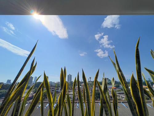 a view of a city from a window with grass at Modern apartment in Colombo in Colombo