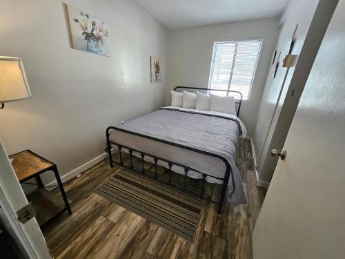 a small bedroom with a bed in a room at Spacious 3 bedroom Condo Close to Weirs Beach!! in Laconia
