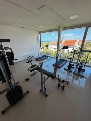 a gym with a row of treadmills and machines at Audencia del Mar in La Paloma