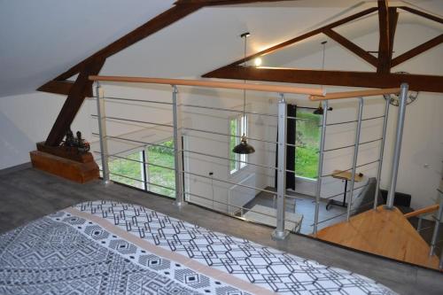 a room with a large window and a white floor at Joinville : Grange entièrement rénovée style loft. in Joinville