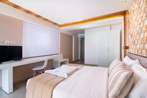 Una cama o camas en una habitación de Aegean Infinity Deluxe