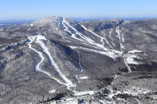 an aerial view of a snow covered mountain at O'Berge du Village C304 - Bord de l'eau in Magog-Orford