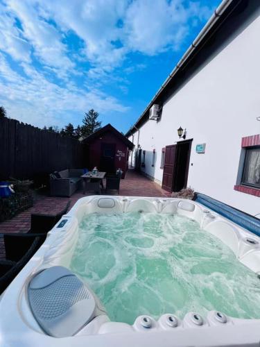 a hot tub in the backyard of a house at Öreg Prés Butikhotel in Mór