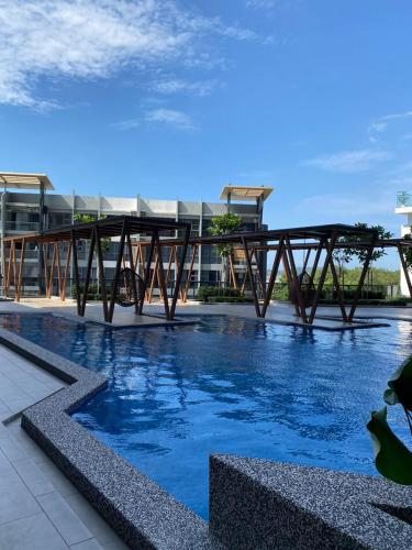 a bridge over the water in a building at K avenue B3A 2bed studio room in Donggongon