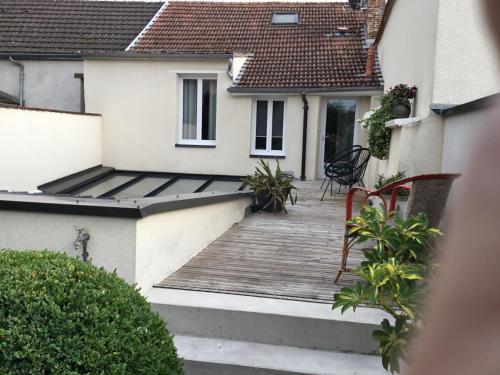 a view of a house with a wooden deck at LE CHARDONNAY Grand Cru in Chouilly