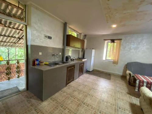 a kitchen with a sink and a refrigerator in a room at Rent Hause in Vedi