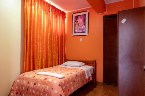 Postel nebo postele na pokoji v ubytování Refugio Hotel