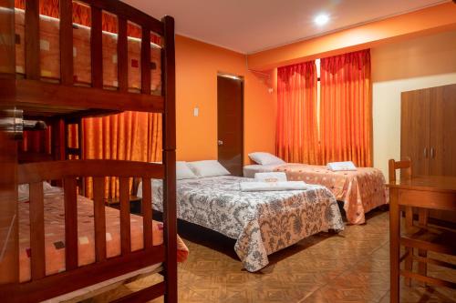 Postel nebo postele na pokoji v ubytování Refugio Hotel
