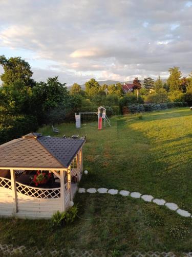 a gazebo in a field with a goal at Apartamenty Wakacyjne Historie in Międzylesie