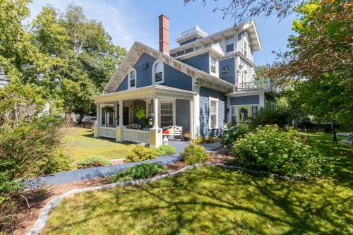 a blue house with a chimney at The Dawson House Bed & Breakfast in Charlottetown