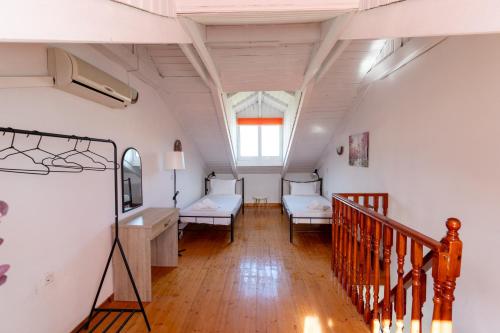 Postel nebo postele na pokoji v ubytování Elpida Hotel