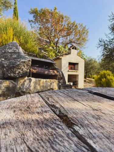 a pile of rocks in front of a house at Pietra Pizzuta Country House in Torre deʼ Passeri