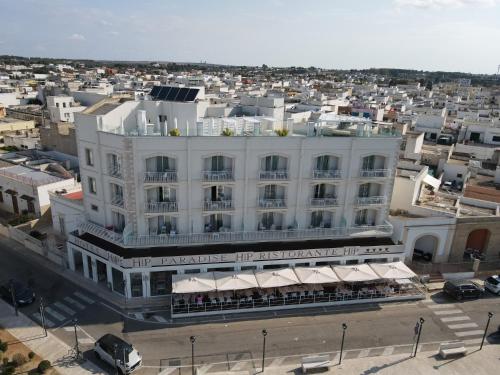 an aerial view of a large white building at HOTEL PARADISE in Porto Cesareo