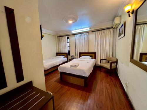 Cama o camas de una habitación en Taleju Grand Hotel