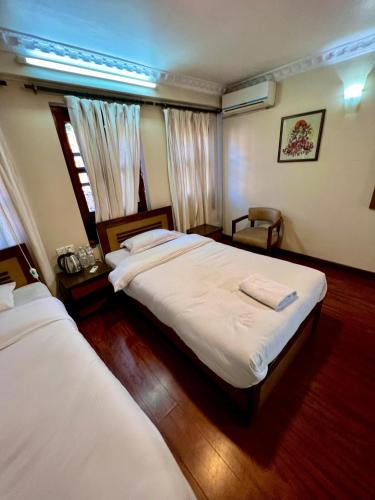 Cama o camas de una habitación en Taleju Grand Hotel