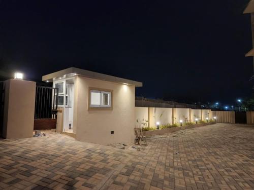 a house with lights on the side of it at night at MYKA SD ZANITA HEIGHTS in Vasco Da Gama