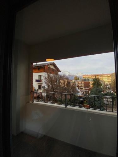 a view from a window of a balcony at Apartments Du Parc in Sauze dʼOulx
