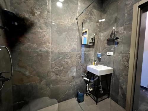 a bathroom with a sink and a shower at ComeLiveGO Cihangir 31 in Istanbul