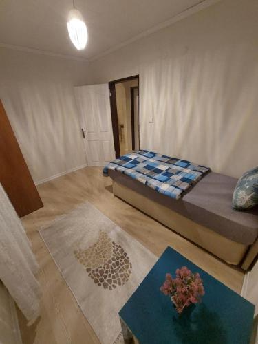 a bedroom with a bed and a table in it at F.A.A Sabiha Gökçen in Istanbul
