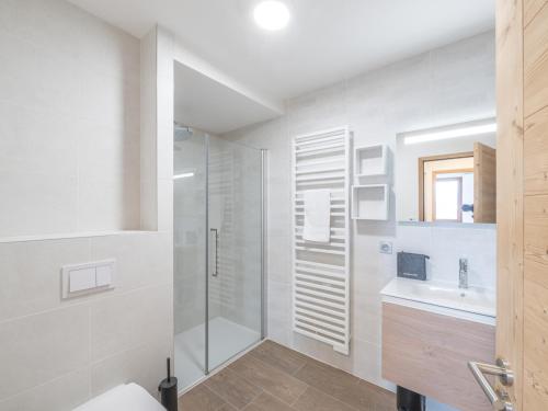 a bathroom with a shower and a toilet and a sink at Bel appartement neuf 8 pers, proche pistes, parking inclus - FR-1-645-49 in LʼHuez