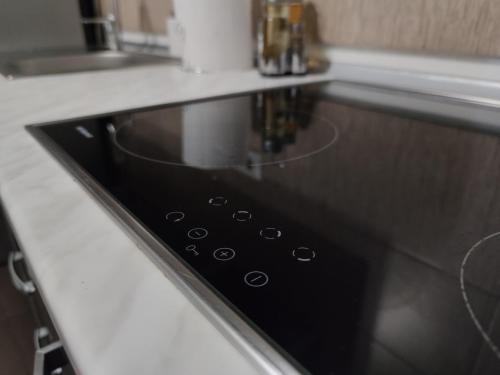 a microwave oven sitting on top of a kitchen counter at Cozy Magic House - Unirii Square in Bucharest