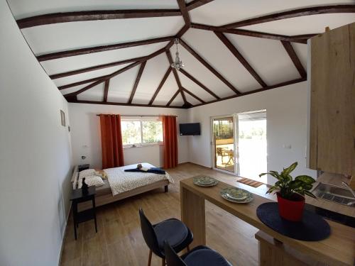 a living room with a ceiling with beams at Relax in Orebić