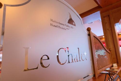 a sign for a lce catalyst store at Family Hotel Desirée in Grächen