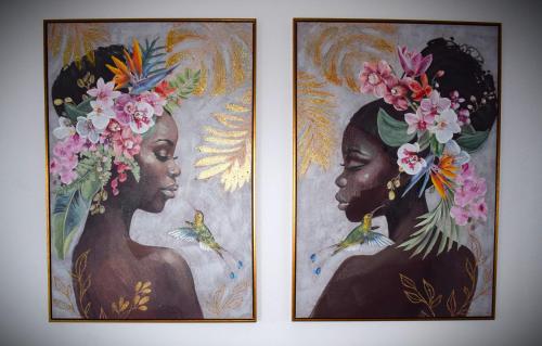 two pictures of two women with flowers on their heads at La Palma Luxury Heritage in Las Ledas