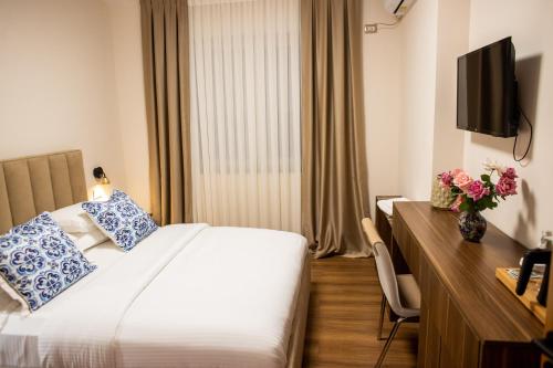 Ένα ή περισσότερα κρεβάτια σε δωμάτιο στο Terra'Vista Apartments