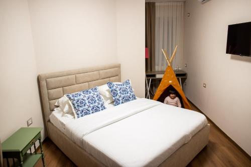 Ένα ή περισσότερα κρεβάτια σε δωμάτιο στο Terra'Vista Apartments