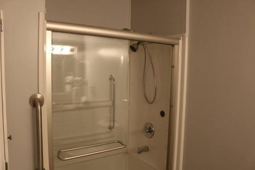 a shower with a glass door in a bathroom at Rt. 682 Athens, 3 Queen bedrooms, 2 baths, Wi-Fi in Athens