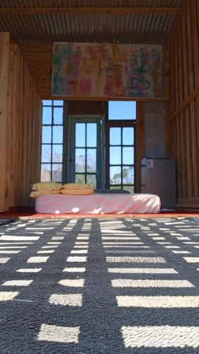a bedroom with a bed in a wooden room at Ladomar Cabañas in La Esmeralda 