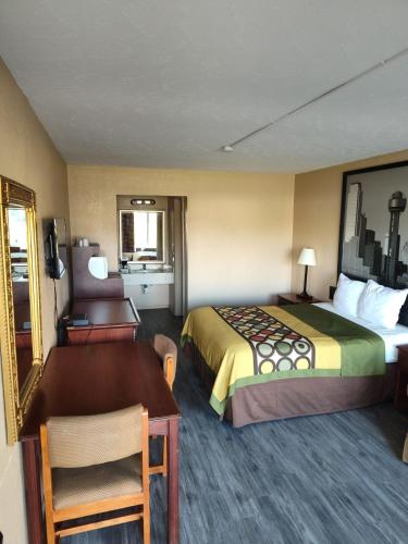 Postel nebo postele na pokoji v ubytování Arya Inn & Extended Stay
