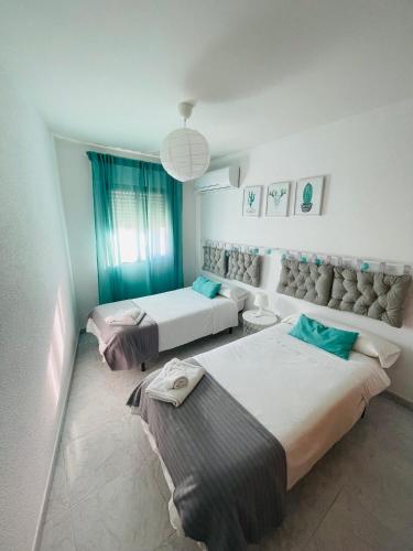a room with three beds in a room at CASA PURI in Candeleda