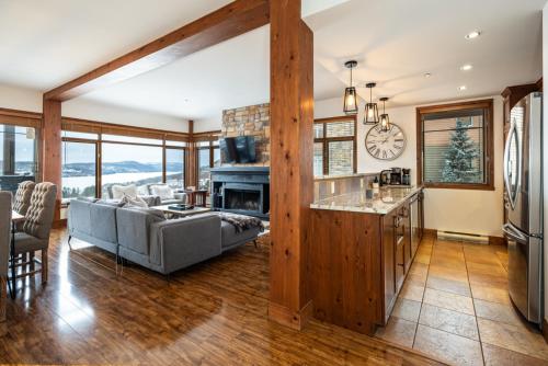 a living room with a couch and a table at Tremblant Prestige - Altitude 170-5 in Mont-Tremblant