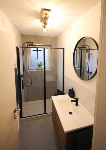 a bathroom with a shower and a sink at Spechthöhle - St. Georgen in Sankt Georgen im Schwarzwald