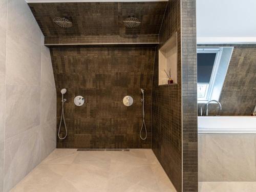a bathroom with a shower and a tub at Beautiful apartment on the first floor Abcoude in Abcoude