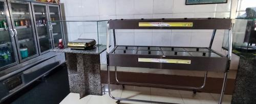 a machine on a counter in a room at HOTEL E RESTAURANTE BOM GOSTO 